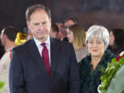 FILE - Supreme Court Justice Samuel Alito Jr., left, and his wife Martha-Ann Alito, pay their respects at the casket of Reverend Billy Graham at the Rotunda of the U.S. Capitol Building in Washington, Feb. 28, 2018. Alito rejects calls to step aside from Supreme Court cases on Trump and Jan. 6.