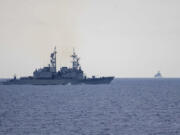 In this photo released by the Taiwan Ministry of National Defense, Taiwan guided missile destroyer Ma Kong DDG1805, left, monitors Chinese guided missile destroyer Xi&rsquo;an DDG15,  right, near Taiwan on Thursday, May 23, 2024. Taiwan tracked dozens of Chinese warplanes and navy vessels off its coast Friday on the second day of a large exercise China&rsquo;s People&rsquo;s Liberation Army held in response to the inauguration of the island&rsquo;s new leadership.