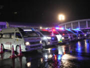 Ambulances wait to carry passengers from a London-Singapore flight that encountered severe turbulence, in Bangkok, Thailand, Tuesday, May 21, 2024. The plane apparently plummeted for a number of minutes before it was diverted to Bangkok, where emergency crews rushed to help injured passengers amid stormy weather, Singapore Airlines said Tuesday.