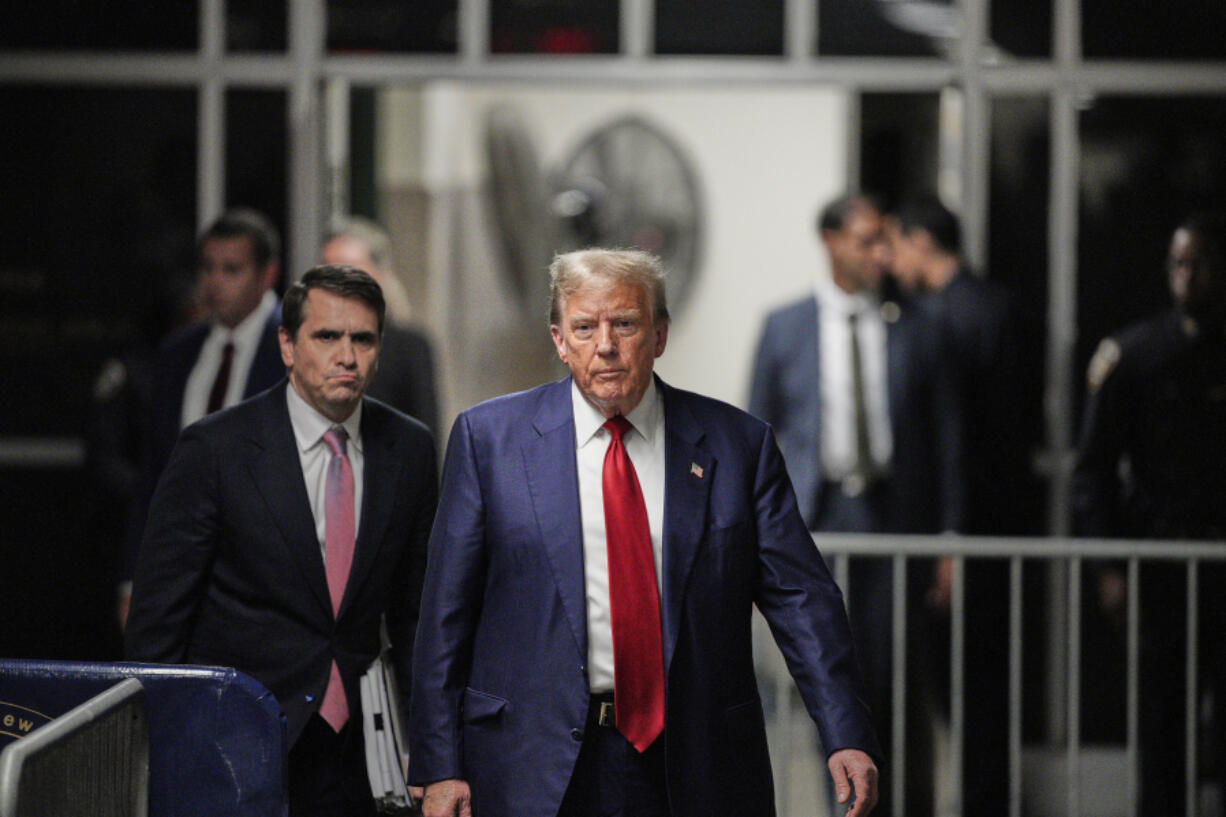 Former President Donald Trump walks outside the courtroom of his trial at Manhattan criminal court, Tuesday, April 30, 2024, in New York.