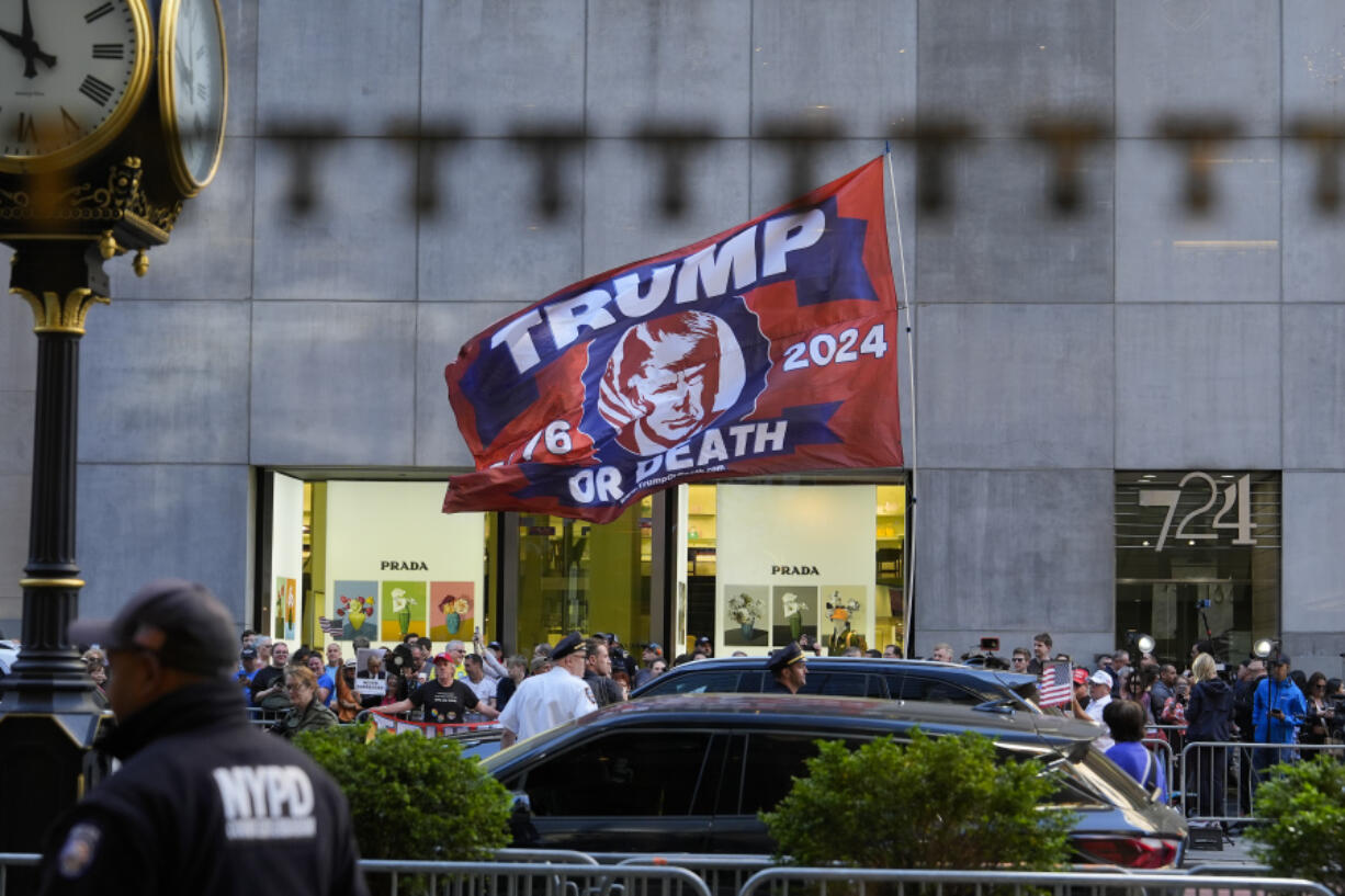 A crowd gathers across the street from Trump Tower, Friday, May 31, 2024, in New York. A day after a New York jury found Donald Trump guilty of 34 felony charges, the presumptive Republican presidential nominee will address the conviction and likely attempt to cast his campaign in a new light.