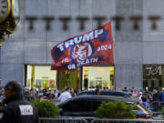 A crowd gathers across the street from Trump Tower, Friday, May 31, 2024, in New York. A day after a New York jury found Donald Trump guilty of 34 felony charges, the presumptive Republican presidential nominee will address the conviction and likely attempt to cast his campaign in a new light.