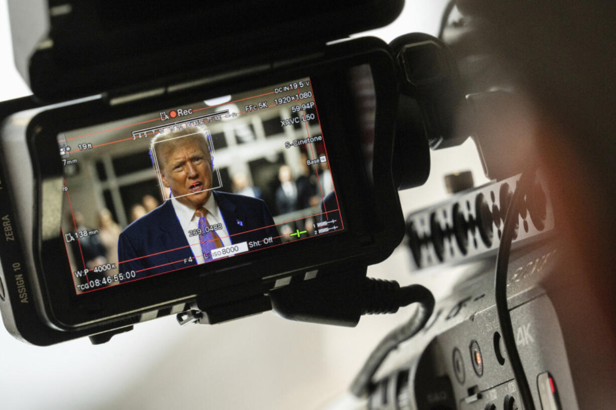 Former President Donald Trump, seen through a camera viewfinder, speaks to members of the media at Manhattan criminal court in New York, on May 2, 2024.