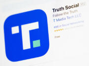 FILE - The download screen for Truth Social app is seen on a laptop computer, March 20, 2024, in New York. Trump Media and Technology Group, the owner of former President Donald Trump&rsquo;s social networking site Truth Social, lost more than $300 million last quarter, according to its first earnings report as a publicly traded company Monday, May 20.