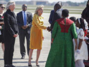 First lady Jill Biden, center, greets Kenya&rsquo;s President William Ruto and first lady Rachel Ruto, center right, as they arrive at Andrews Air Force Base, Md., Wednesday, May 22, 2024, for a State Visit to the United States. (AP Photo/Luis M.