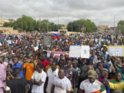 FILE - Supporters of Niger&#039;s ruling junta gather for a protest called to fight for the country&#039;s freedom and push back against foreign interference, in Niamey, Niger, Aug. 3, 2023. Russia has moved some troops onto an airbase in Niger where a small number of U.S. forces remain after most American troops left the base in Niamey, the nation&#039;s capital, a U.S. official said Thursday, May 2, 2024.