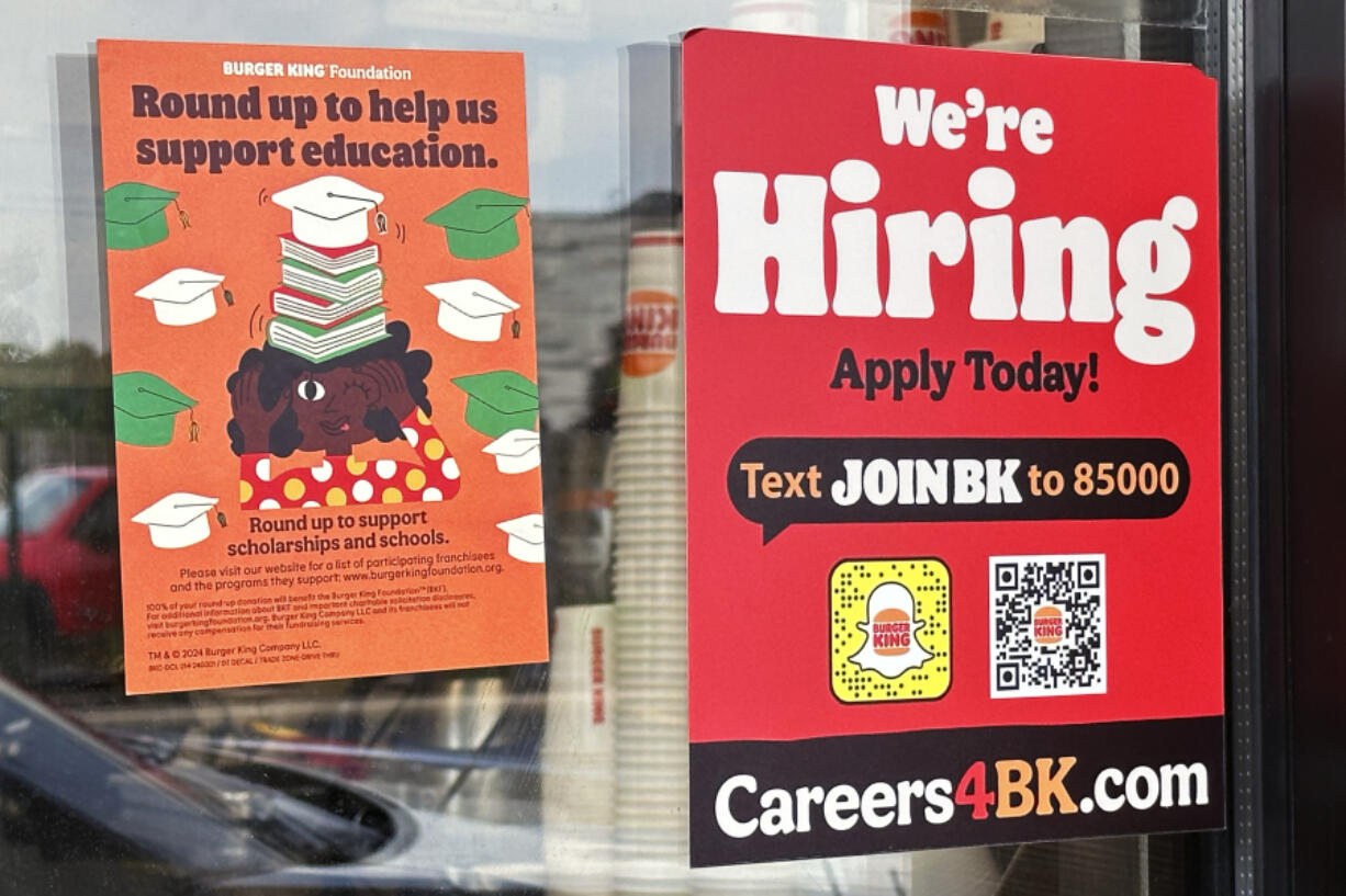 A sign seeking job applicants is displayed at a restaurant in Wheeling, Ill., Thursday, May 16, 2024. On Thursday, May 23, 2024, the Labor Department reports on the number of people who applied for unemployment benefits last week.(AP Photo/Nam Y.