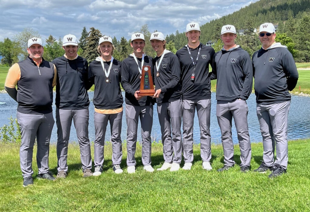 Members of the Washougal boys golf team poses with the second-place trophy after a runner-up finish at the 2A state tournament at Liberty Lake Golf Course in Liberty Lake. Pictured (from left to right) coach Mike Minnis, Brayden Kassel, Jude King, Trent Maddox, Mason Acker, Keagan Payne, Mather Minnis and assistant coach John Walker.