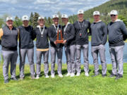 Members of the Washougal boys golf team poses with the second-place trophy after a runner-up finish at the 2A state tournament at Liberty Lake Golf Course in Liberty Lake. Pictured (from left to right) coach Mike Minnis, Brayden Kassel, Jude King, Trent Maddox, Mason Acker, Keagan Payne, Mather Minnis and assistant coach John Walker.