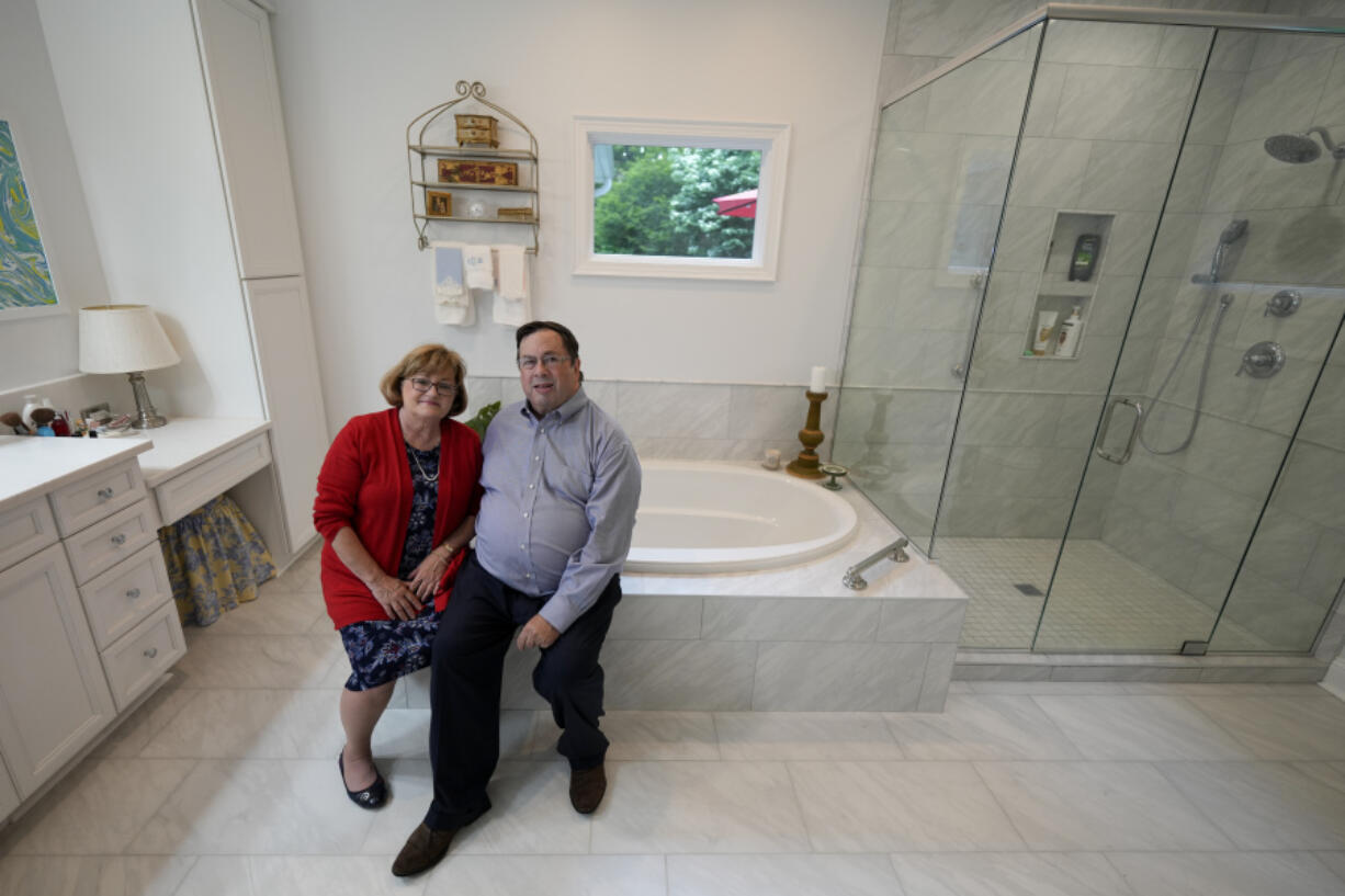 Sallie and Gene Carr pose for a picture in their recently remodeled home on May 7 in Hendersonville, N.C. An increasing number of Americans in their late 50s and older are staying in their houses, some by choice, others because they&rsquo;re locked into low mortgage rates that are too low to give up.