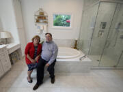 Sallie and Gene Carr pose for a picture in their recently remodeled home on May 7 in Hendersonville, N.C. An increasing number of Americans in their late 50s and older are staying in their houses, some by choice, others because they&rsquo;re locked into low mortgage rates that are too low to give up.