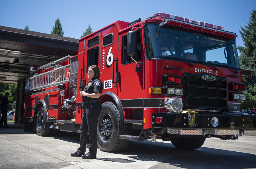 Clark County Fire District 6 Fire Chief Kristan Maurer stands in front of a new fire engine July 13 at Station 62.