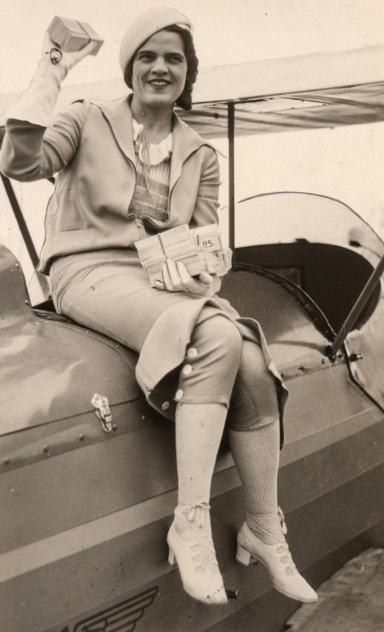 Sitting on a biplane, Edith Foltz sports the Foltz-Up outfit she designed to make it easy for women pilots to go from the cockpit to dinner. Her experience racing in the 1929 Women&rsquo;s Air Derby inspired her versatile design because on stopovers, the pilots had to go immediately to dine with local officials. Portland department store Meier and Frank sold her dress in the 1930s.