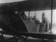 In August 1924, Kolumbia Klavern No. 1 flew an illuminated cross over the Clark County Fairgrounds at Bagley Downs. This photo, taken at an unknown location in 1922, shows two Klu Klux Klansmen climbing into a plane as they prepared to drop propaganda leaflets.