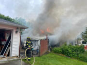 Vancouver Fire Department
Vancouver firefighters rescued one person and six dogs from a burning house Sunday afternoon in the 4600 block of N.E. 47th Street.