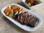 Coffee-rubbed steak is roasted in the oven with sweet potatoes, shallots and apples for an easy meal for two.