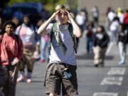 Olin Wilkerson, a junior at Garfield High School, reacts after being released from lockdown following a shooting outside of the school on Thursday, June 6, 2024, in Seattle.