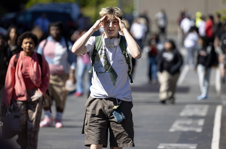 Olin Wilkerson, a junior at Garfield High School, reacts after being released from lockdown following a shooting outside of the school on Thursday, June 6, 2024, in Seattle.