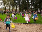 Kids scramble for eggs during the annual Easter egg hunt at Crown Park in Camas in 2019.