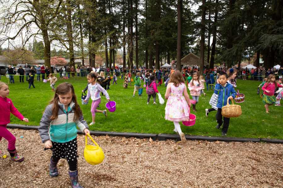 Kids scramble for eggs during the annual Easter egg hunt at Crown Park in Camas in 2019.