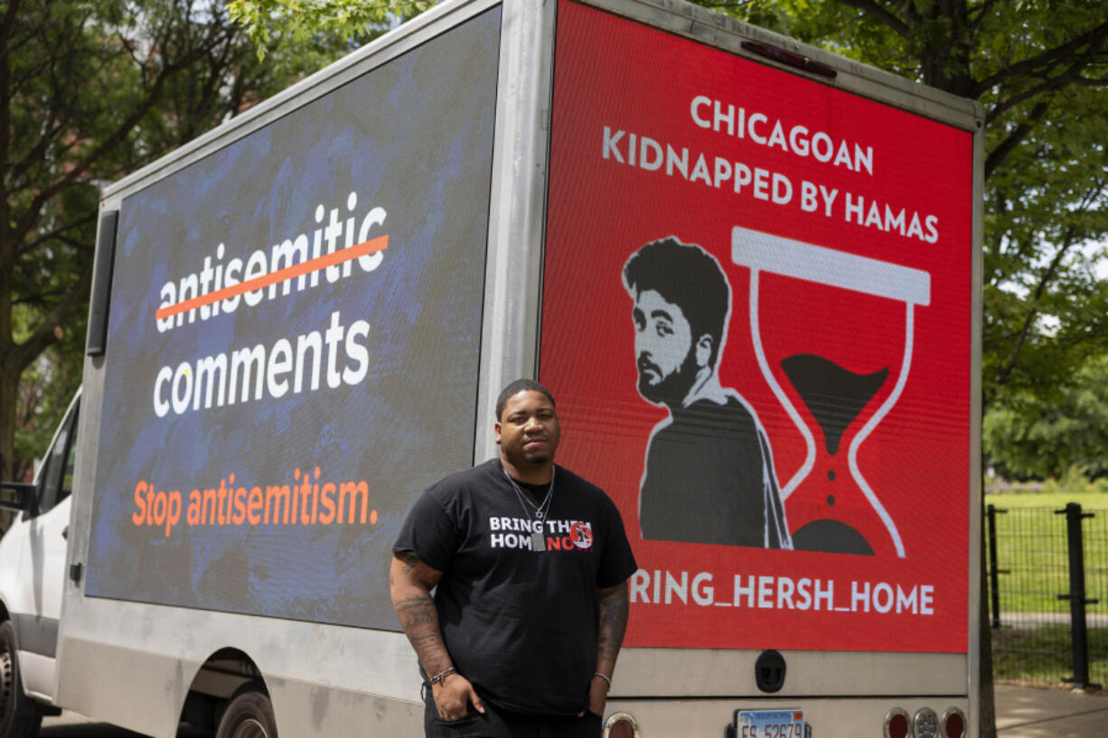 Jeremiah Smith with his truck that has digital screens meant to raise awareness for Israelis taken hostage by Hamas last year on May 31, 2024, near Bartelme Park in Chicago.