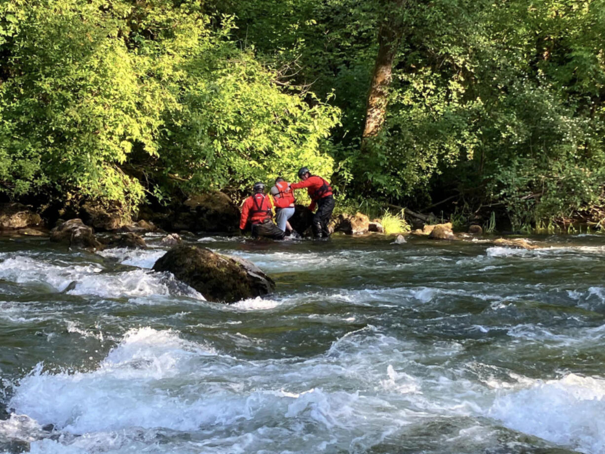 Contributed by Clark-Cowlitz Fire Rescue
Rescuers bring a stranded swimmer to shore of the East Fork Lewis River on Sunday. It was the second water rescue of the weekend for Clark-Cowlitz Fire Rescue.