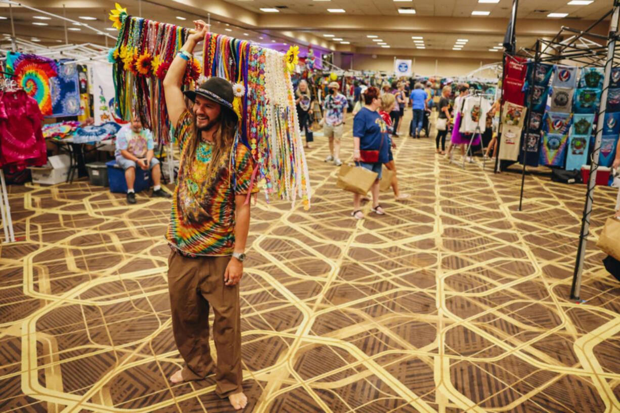 Shayne Dunn sells floral headbands at Shakedown Street at the Tuscany Suites on May 30, 2024, in Las Vegas. Shakedown Street is a vending and tailgating space before Dead &amp; Company concerts. Named after a Grateful Dead song, it began in the early 1980s.