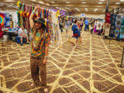 Shayne Dunn sells floral headbands at Shakedown Street at the Tuscany Suites on May 30, 2024, in Las Vegas. Shakedown Street is a vending and tailgating space before Dead &amp; Company concerts. Named after a Grateful Dead song, it began in the early 1980s.