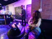 Actor DeJuan Ford walks into a scene as writer, director, and executive producer Lisa Brown watches on monitors Feb. 26 during filming of Season 3 of &ldquo;The Dirty D&rdquo; in Detroit.