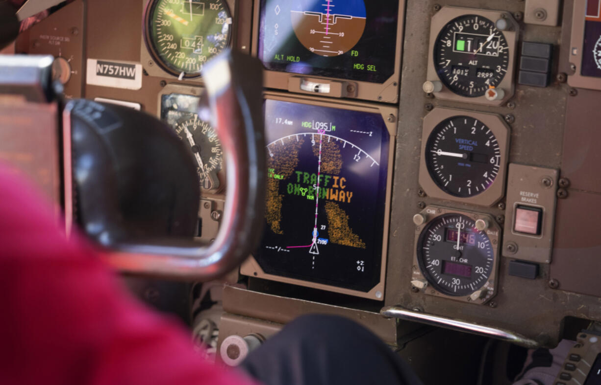 When a plane is on the runway at the airport in Yakima, Washington, a warning appears on an instrument panel in the cockpit of a 757 research plane that is coming in for a landing, Friday, June 7, 2024. (Ellen M.