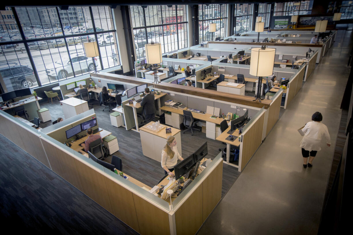 First-floor cubicle space in the Millwright office building by Ryan Cos. in Minneapolis&rsquo; Downtown East area in 2017. The &ldquo;hoteling&rdquo; concept would scrap permanent desks at offices in favor of flexible, shared spaces.