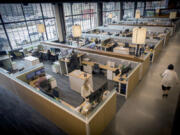 First-floor cubicle space in the Millwright office building by Ryan Cos. in Minneapolis&rsquo; Downtown East area in 2017. The &ldquo;hoteling&rdquo; concept would scrap permanent desks at offices in favor of flexible, shared spaces.