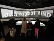 Guests look at one of the installations as the Academy Museum hosts &ldquo;Hollywoodland: Jewish Founders and the Making of a Movie Capital&rdquo; media preview at Academy Museum of Motion Pictures on May 16, 2024, in Los Angeles.