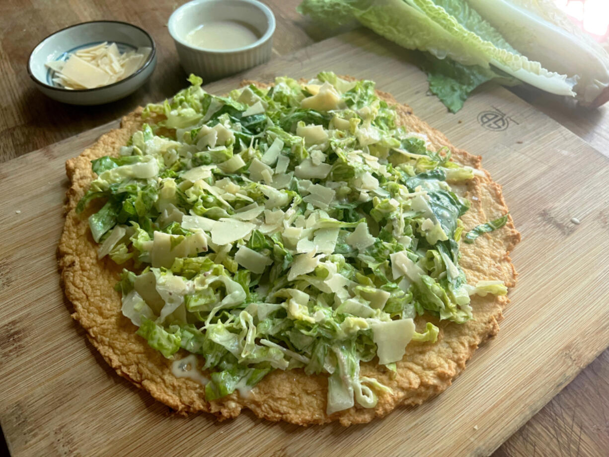 Canned chicken mixed with egg and grated Parmesan serves as the base for this caesar salad pizza that&rsquo;s gone viral on TikTok.