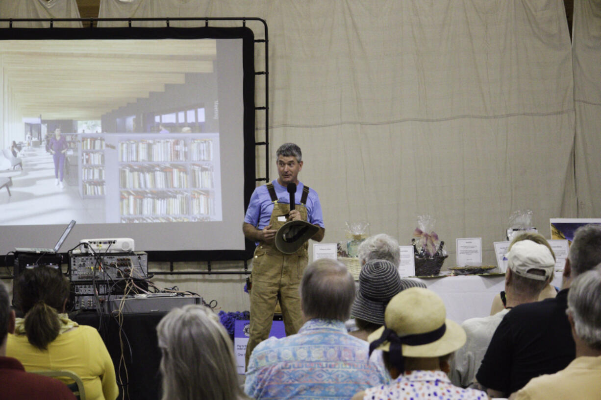 John Spencer talks during the &ldquo;Novel Night&rdquo; fundraising event at his Get To-Gather Farm in Camas in August 2022.