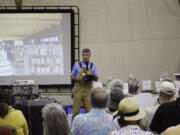 John Spencer talks during the &ldquo;Novel Night&rdquo; fundraising event at his Get To-Gather Farm in Camas in August 2022.