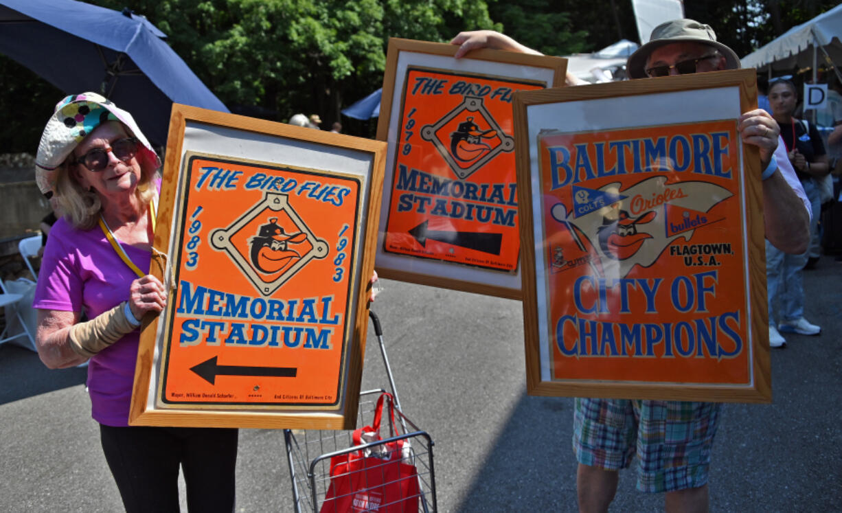 Rosalie and Ivo, of Baltimore, show directional signs to Memorial Stadium that once hung on lampposts. They brought them to the Maryland Zoo in Baltimore on Tuesday, June 17, 2024, where &ldquo;Antiques Roadshow&rdquo; was giving appraisals and filming three episodes for the show&rsquo;s 29th season.