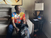 Malcolm Reid at home in Decatur, Georgia, with his dog, Sampson. Reid, who recently marked his 66th birthday and the anniversary of his HIV diagnosis, is part of a growing group of people 50 and older living with the virus.