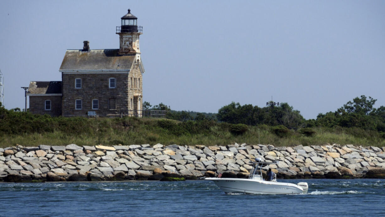 Plum Island Lighthouse, built in 1869, is familiar to fishermen. Congress has added language to the recently enacted federal budget that conservationists say will speed the process of converting the tiny island at the eastern approach to Long Island Sound to a nature preserve.