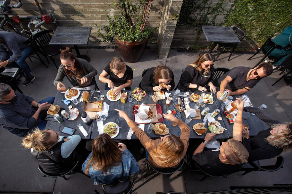 People enjoy their lunch while eating in the back patio at Citizen Public Market, Culver City&rsquo;s newest food hall, on Nov. 19, 2021.