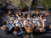 People enjoy their lunch while eating in the back patio at Citizen Public Market, Culver City&rsquo;s newest food hall, on Nov. 19, 2021.