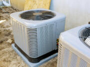 Outdoor air conditioning units require a certain amount of clearance space from plants and obstructions to work correctly.