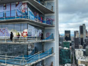 Taggers have graffitied what appears to be more than 25 stories of a downtown Los Angeles skyscraper that&rsquo;s been sitting dormant for several years. Construction on Oceanwide Plaza, a $1 billion mixed-use retail and luxury apartments project with three towering unfinished structures, stalled in January 2019 after the Beijing-based developer lacked the funds to complete it.