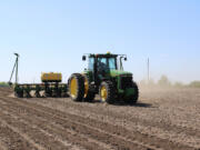 Josh Kruse plants corn near Boone, Iowa, on May 17, 2024. Kruse runs the 500-acre farm with brother-in-law Jason Haglund, who grew up there and is a mental health advocate.