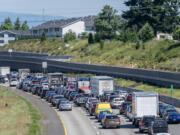 Northbound traffic beyond a road closure backs up on Interstate 205 on Monday, June 10, 2024, in Vancouver. Suspects in an Oregon vehicle theft barricaded themselves in a semi cab on Interstate 205, forcing the closure of all lanes in both directions for about two hours Monday morning, according to the Washington State Department of Transportation.