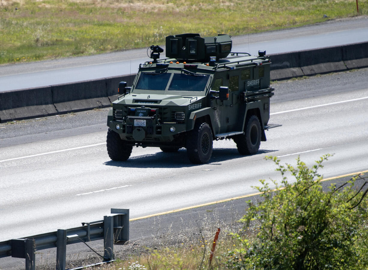 An armored Clark County SheriffÄôs Office car heads north on Interstate 205 on Monday, June 10, 2024, in Vancouver. Suspects in an Oregon vehicle theft barricaded themselves in a semi cab on Interstate 205, forcing the closure of all lanes in both directions for about two hours Monday morning, according to the Washington State Department of Transportation.