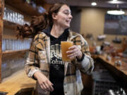 Mariah Fechtner of Backwoods Brewing Company serves up a cold pint of Hazy Nelson while working at the pub in Carson.