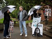 Sela Blas of the National Women&rsquo;s Coalition Against Violence &amp; Exploitation, from left, joins supporters of Star Murrah, including Joe Thuney, Danielle Mikinka and Christina Dodds on Monday while standing outside the Clark County Courthouse. The group was rallying against the possibility that the man accused of killing Star Murrah, her estranged husband, is found not-guilty by reason of insanity. His hearing is scheduled for Thursday.