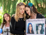 Rene Hanson, from left, joins Angel Ristau and her mom, Jenn Ristau, on the steps of the Clark County Courthouse after Michael Murrah, the estranged husband of their friend, Star Murrah, was found not guilty by reason of insanity Thursday in her 2021 killing. All three women were close friends of Star Murrah&rsquo;s, and the 45-year-old was Angel Ristau&rsquo;s godmother. &ldquo;She was like a second mom,&rdquo; she said.