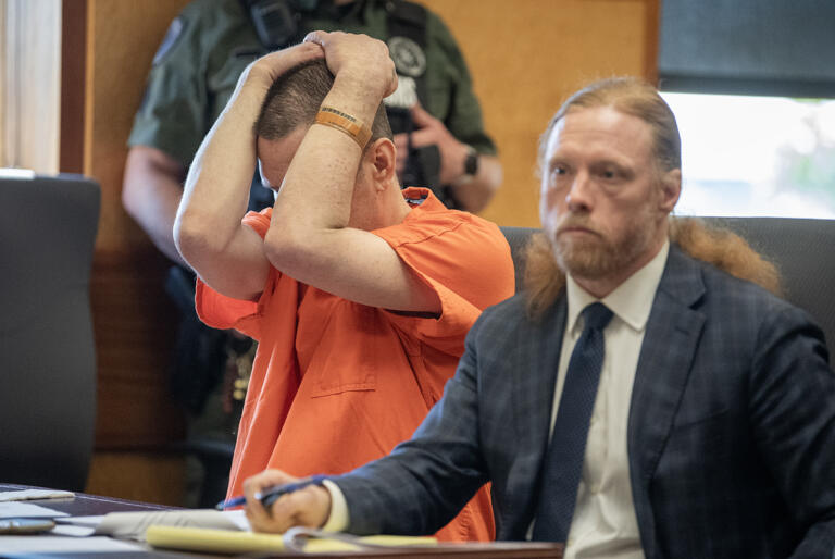 Defendant Michael Murrah, left, is overcome by emotion while joined by his lawyer, defense attorney Shon Bogar, at the Clark County Courthouse on Thursday morning, June 6, 2024.